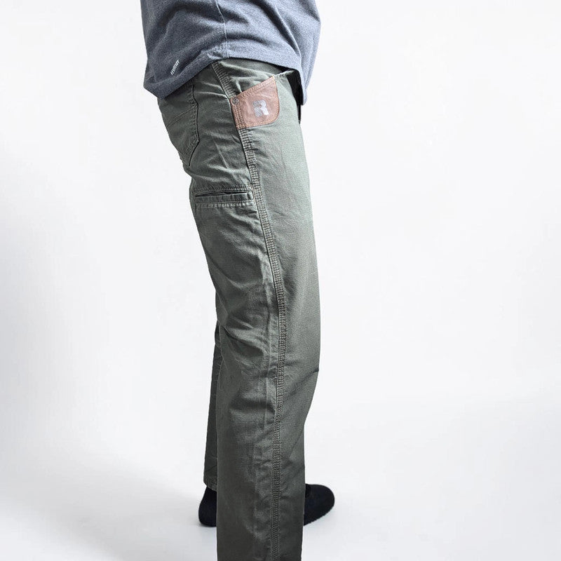 Wrangler khaki straight jeans with utility pockets and sturdy fabric.