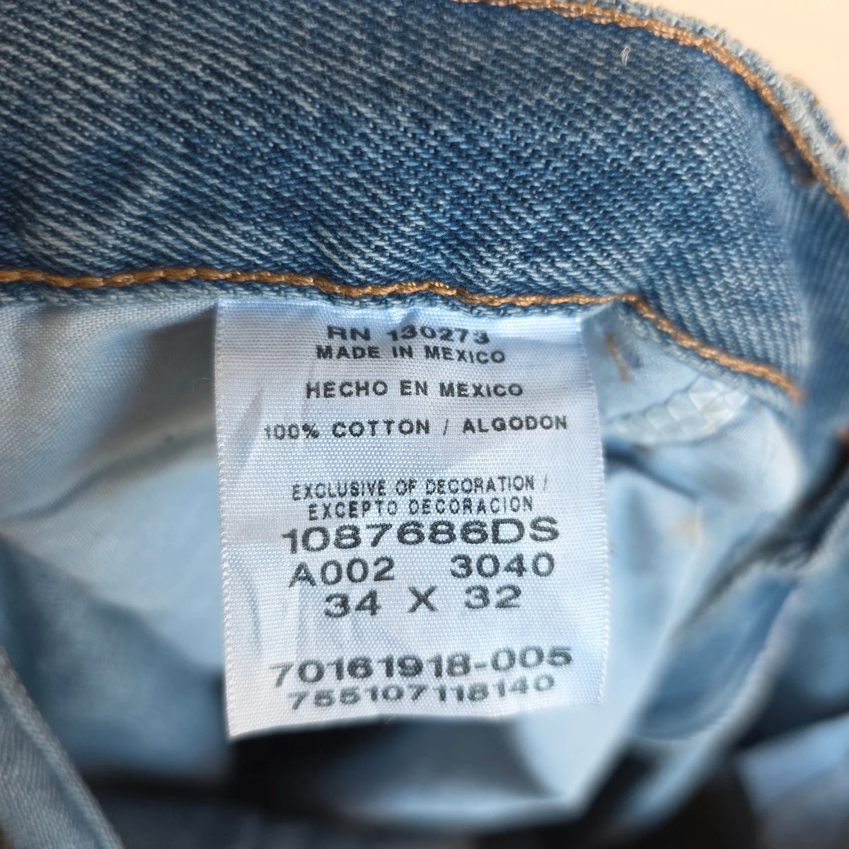 Rustler blue carpenter jeans with utility pockets and hammer loop detailing.