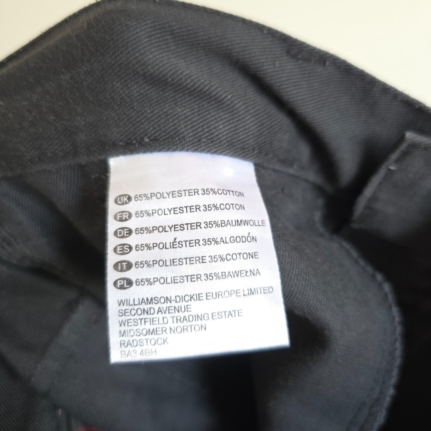 Dickies black cargo trousers with double knee panels and hammer loop detail.