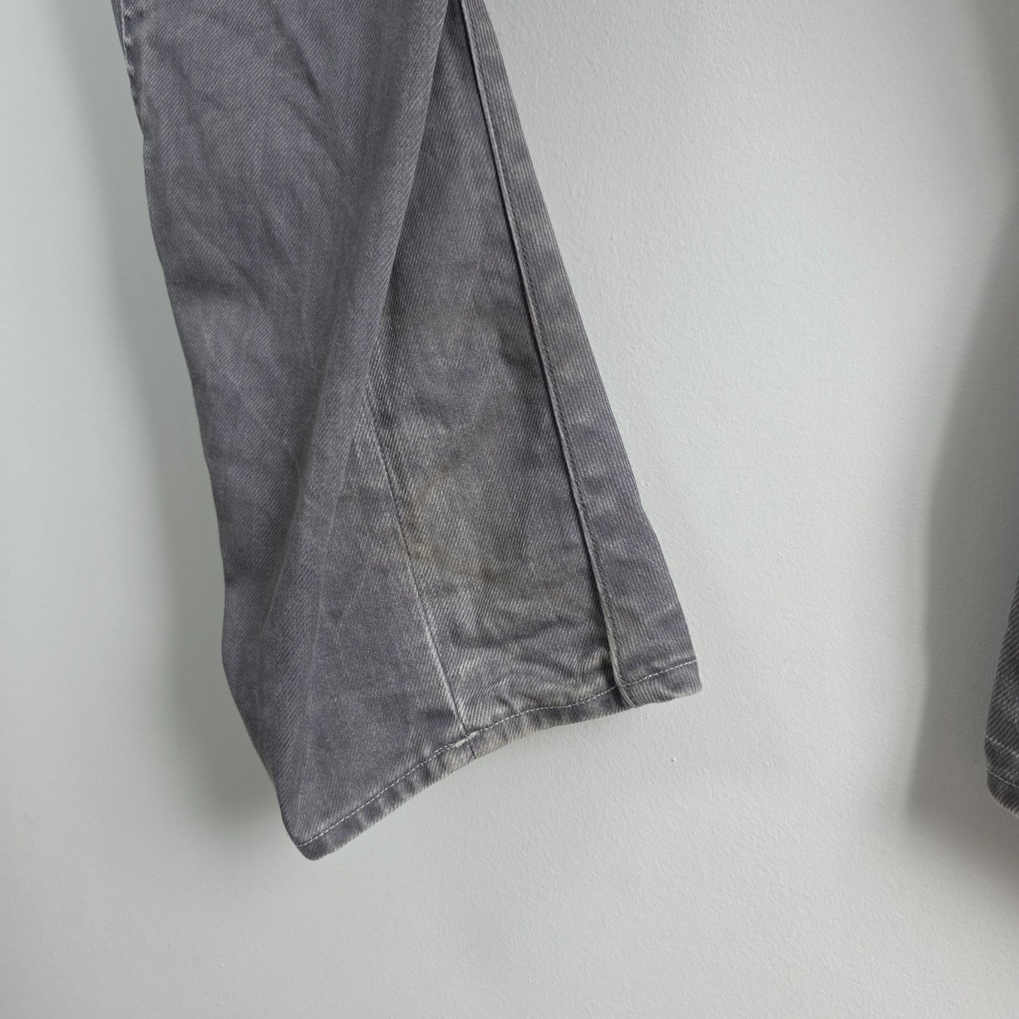G-Star grey straight jeans with biker style detailing and subtle wear at the hem.