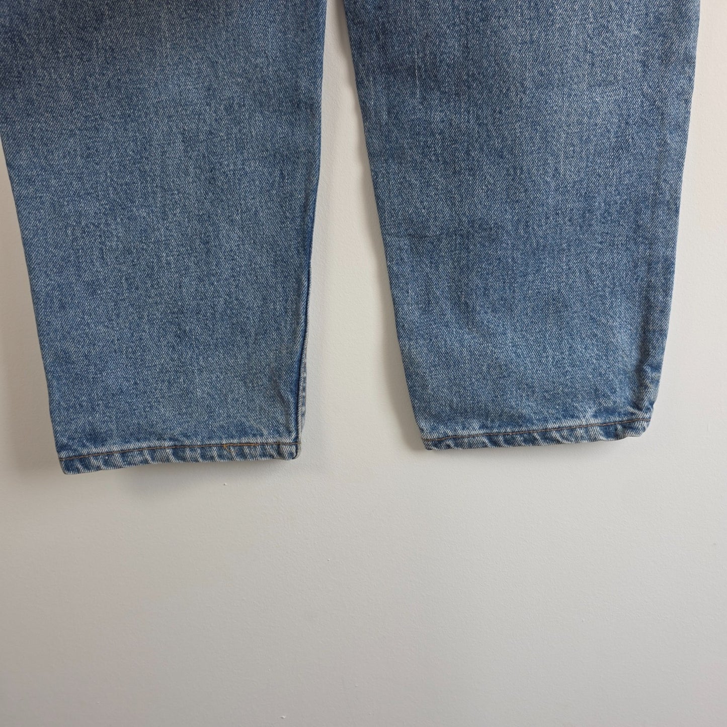 Levi's blue straight jeans vintage 550 relaxed fit with classic 90s silhouette.