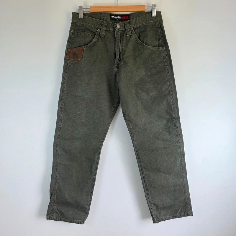 Wrangler khaki straight jeans with utility pockets and sturdy fabric.