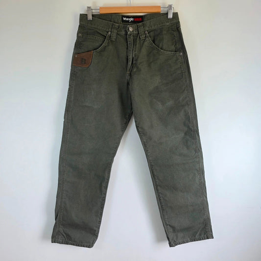 Wrangler khaki straight jeans with utility pockets and sturdy fabric.