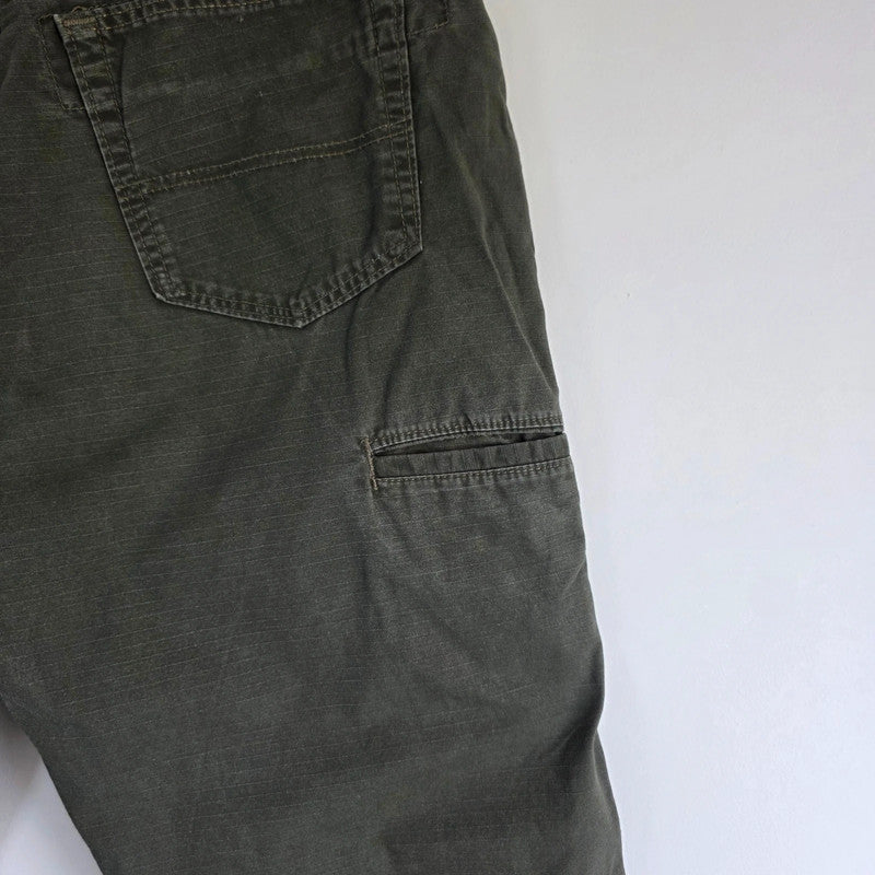 Wrangler khaki straight jeans with utility pockets and sturdy fabric.