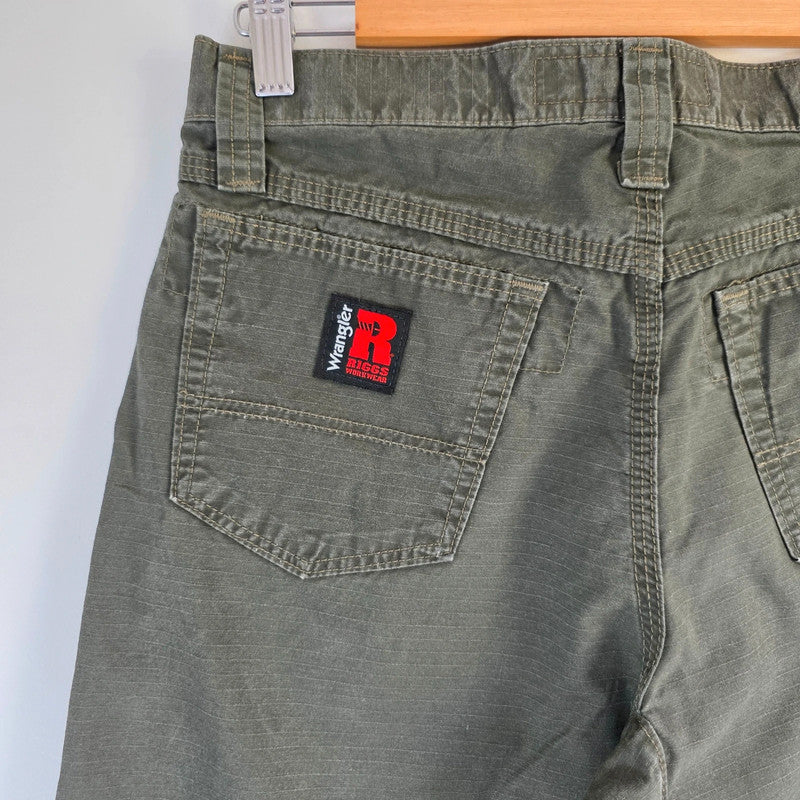 Wrangler khaki straight jeans with utility pockets and sturdy fabric.