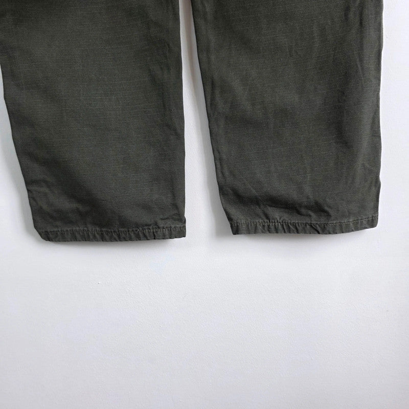 Wrangler khaki straight jeans with utility pockets and sturdy fabric.