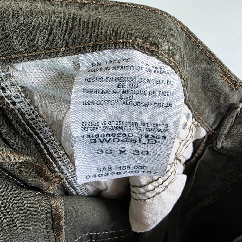 Wrangler khaki straight jeans with utility pockets and sturdy fabric.