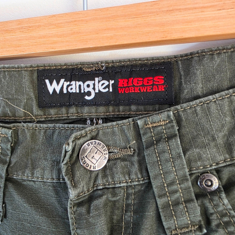 Wrangler khaki straight jeans with utility pockets and sturdy fabric.