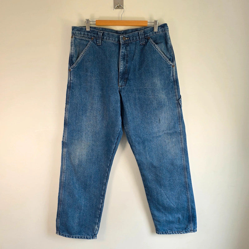 Wrangler blue straight jeans fleece lined with utility pockets and light wear.