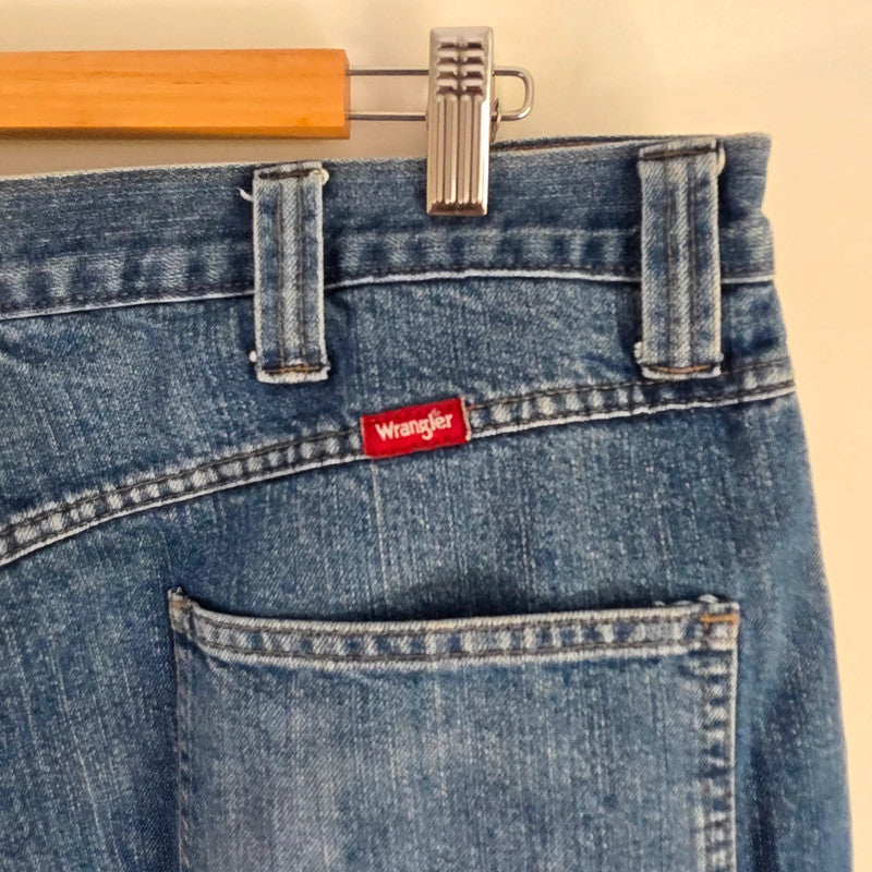 Wrangler blue straight jeans fleece lined with utility pockets and light wear.