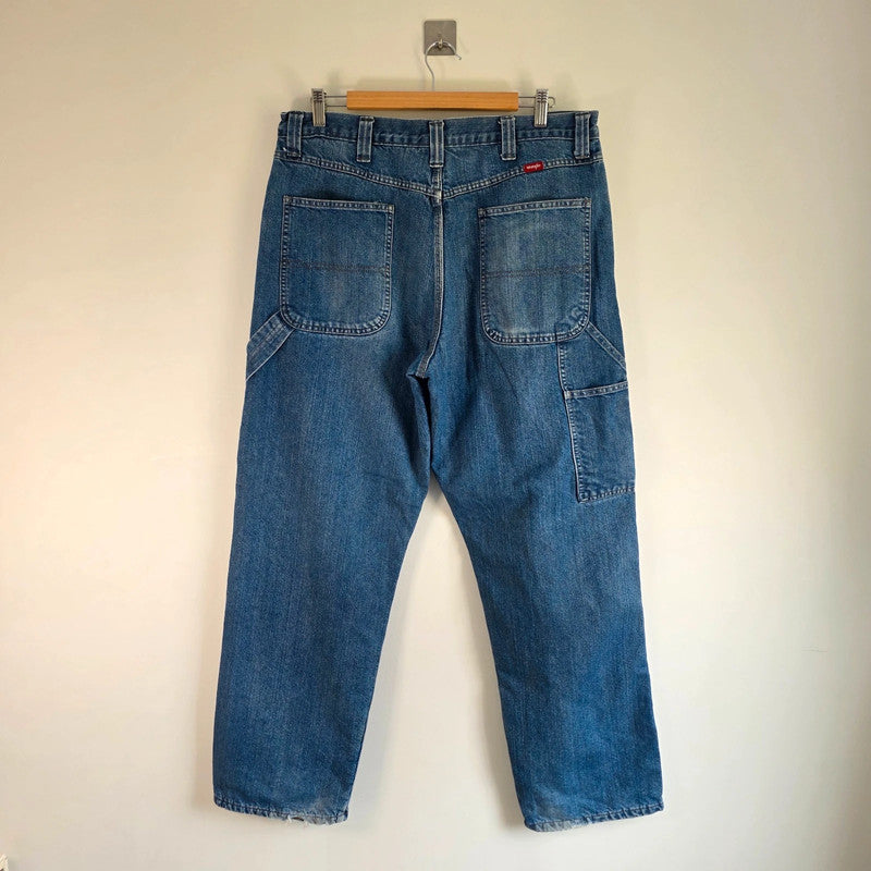 Wrangler blue straight jeans fleece lined with utility pockets and light wear.