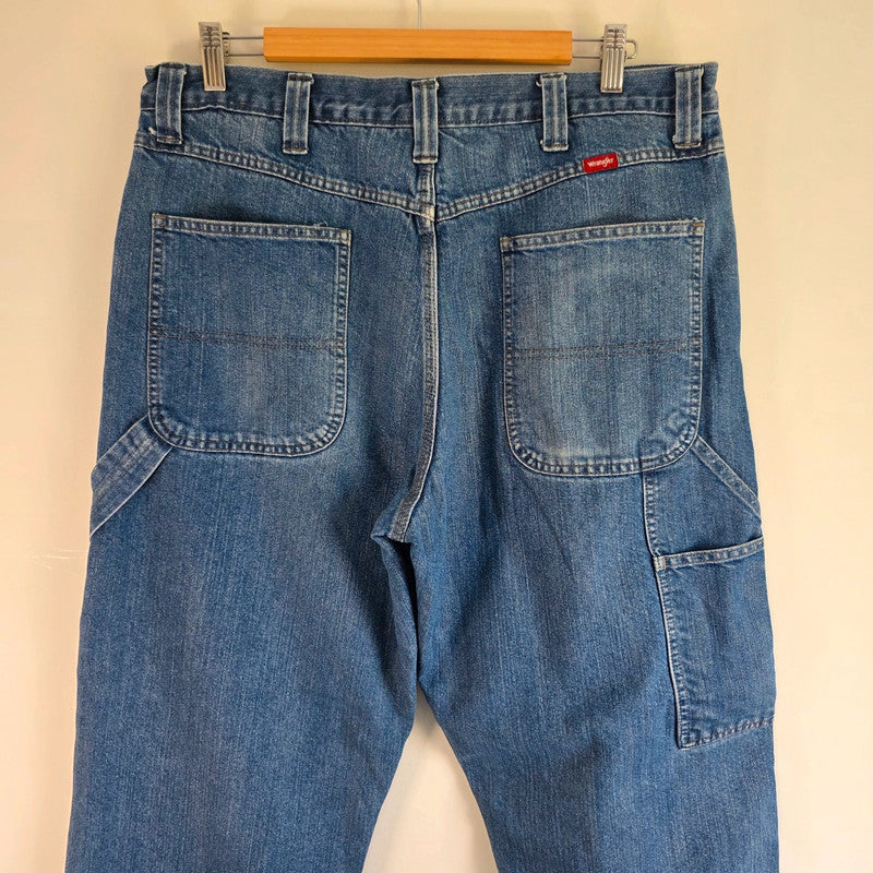 Wrangler blue straight jeans fleece lined with utility pockets and light wear.