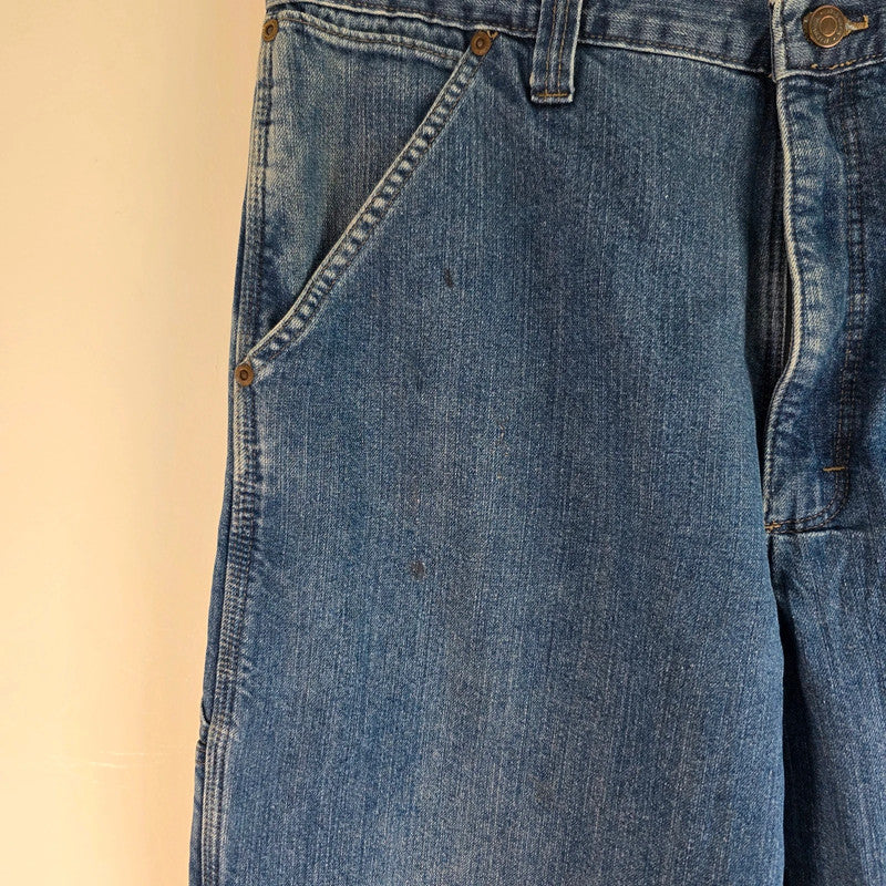 Wrangler blue straight jeans fleece lined with utility pockets and light wear.