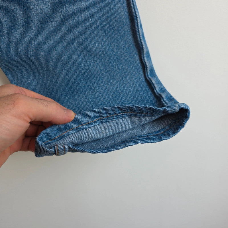 Robe Di Kappa blue straight jeans with vintage logo patch and cotton material.