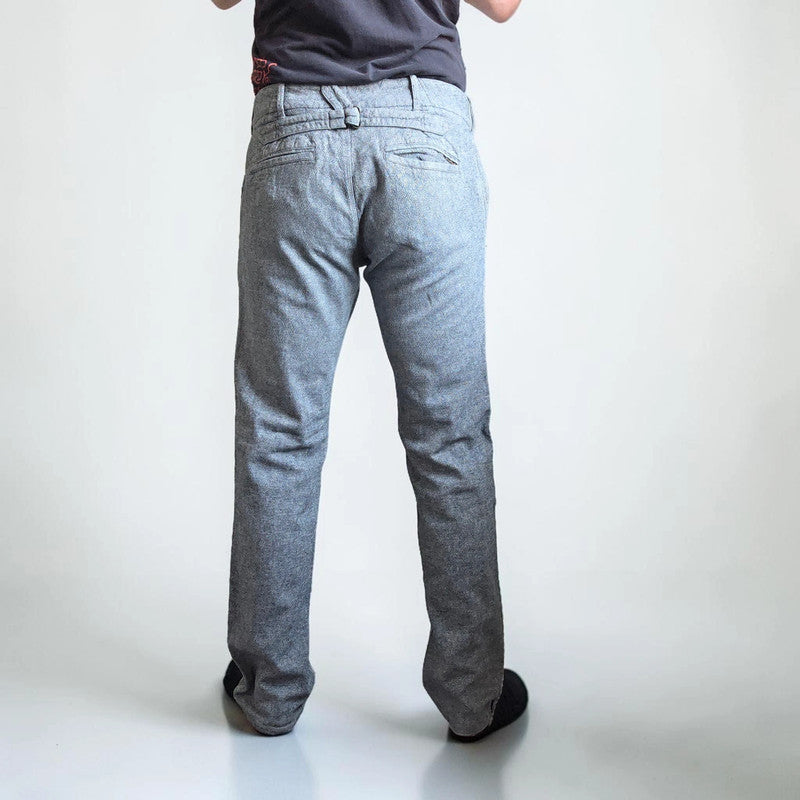Diesel grey cotton trousers with slim straight fit and subtle wear details.