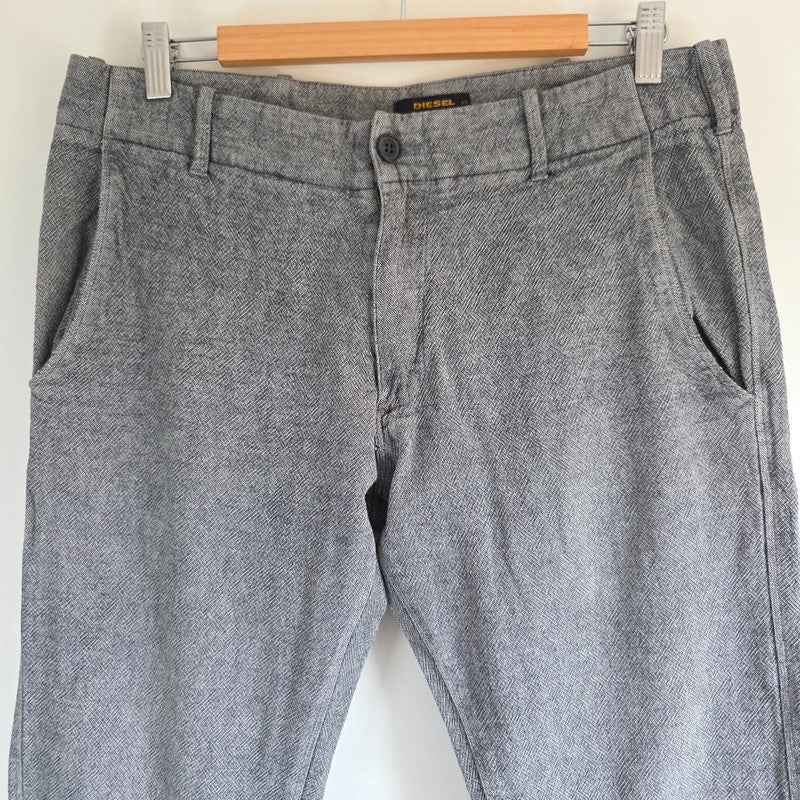 Diesel grey cotton trousers with slim straight fit and subtle wear details.