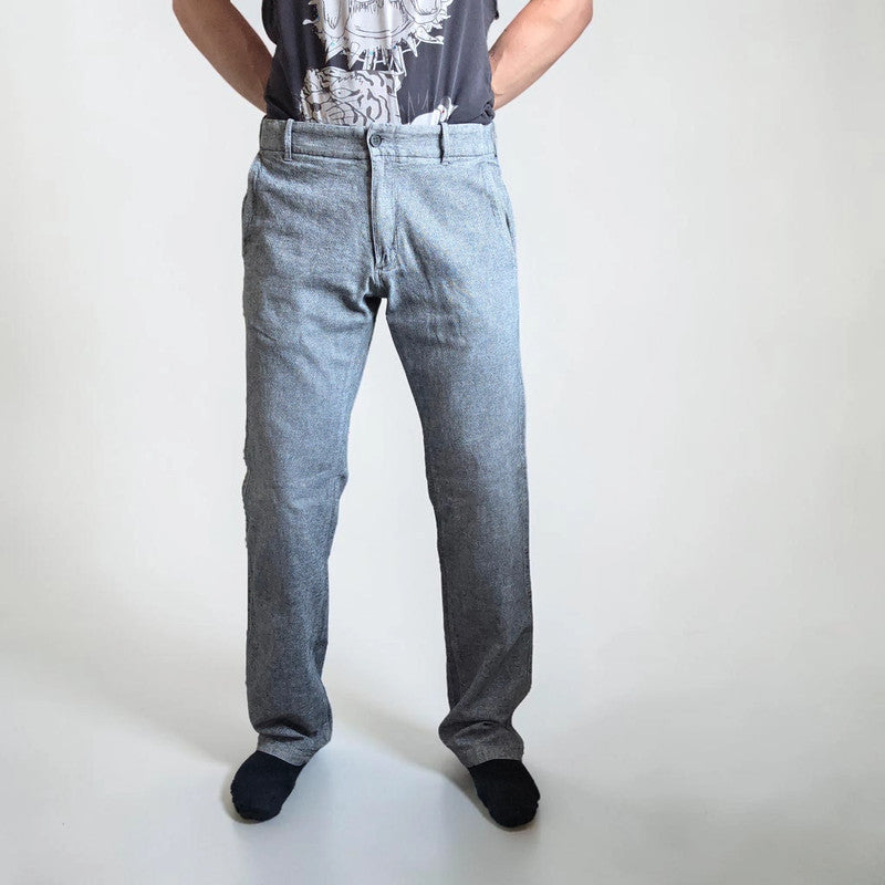 Diesel grey cotton trousers with slim straight fit and subtle wear details.