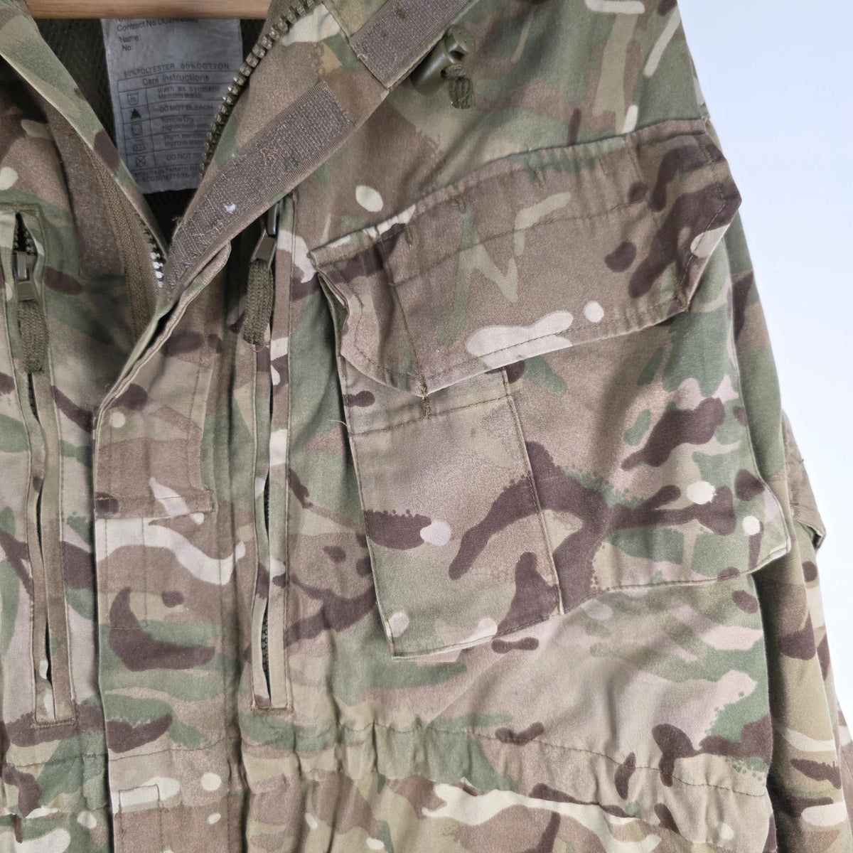 Army green khaki MTP combat smock jacket with Union Jack patch and multiple pockets.