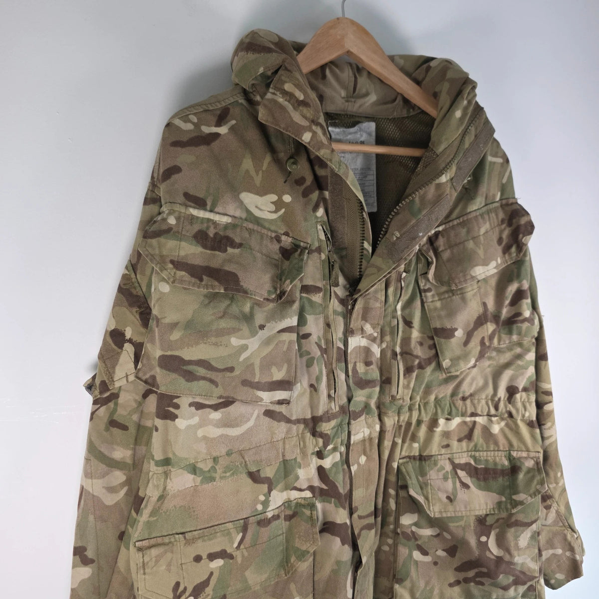 Army green khaki MTP combat smock jacket with Union Jack patch and multiple pockets.