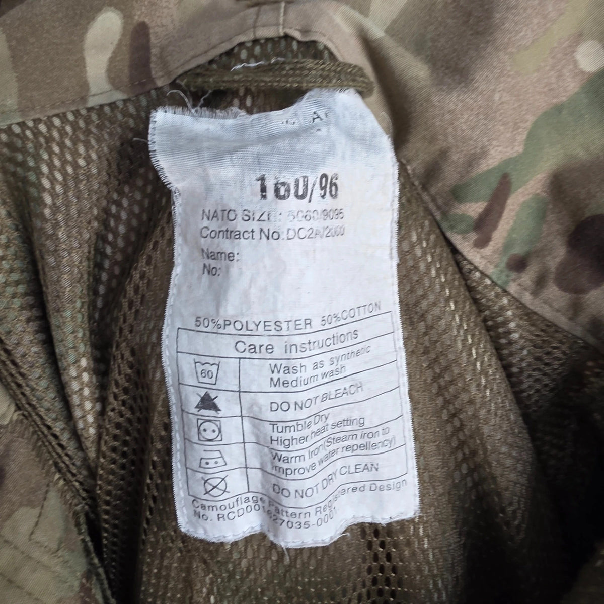 Army green khaki MTP combat smock jacket with Union Jack patch and multiple pockets.