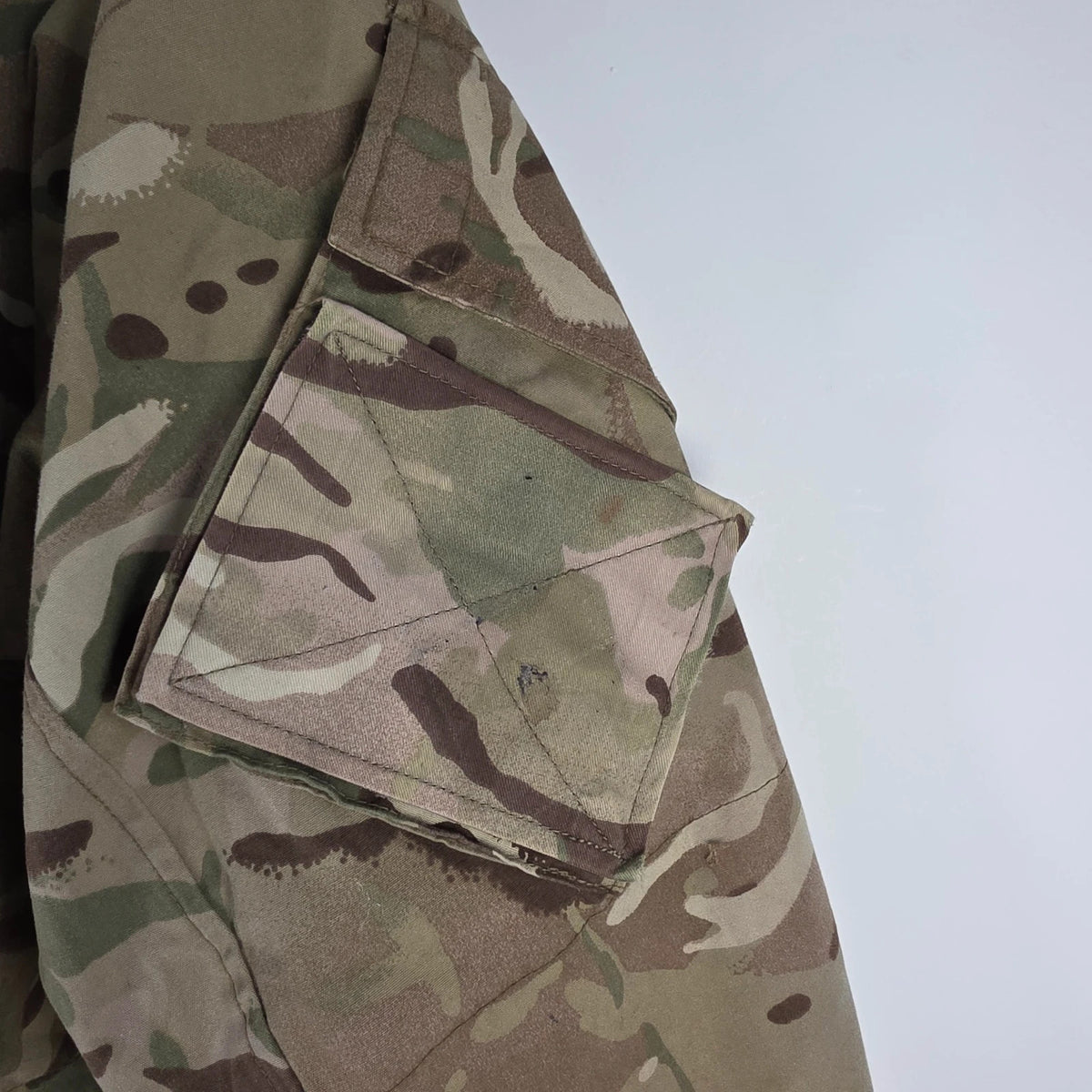 Army green khaki MTP combat smock jacket with Union Jack patch and multiple pockets.