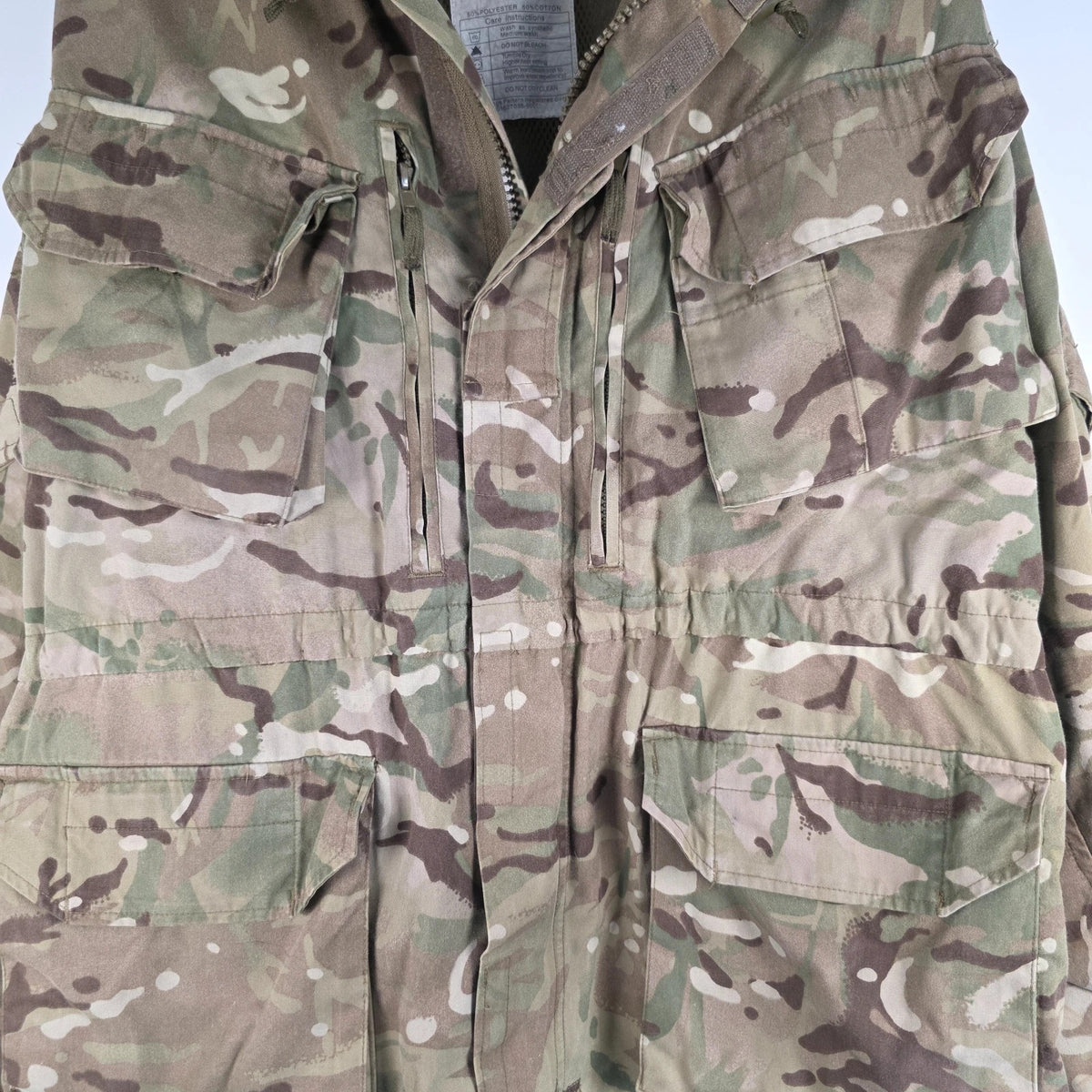 Army green khaki MTP combat smock jacket with Union Jack patch and multiple pockets.
