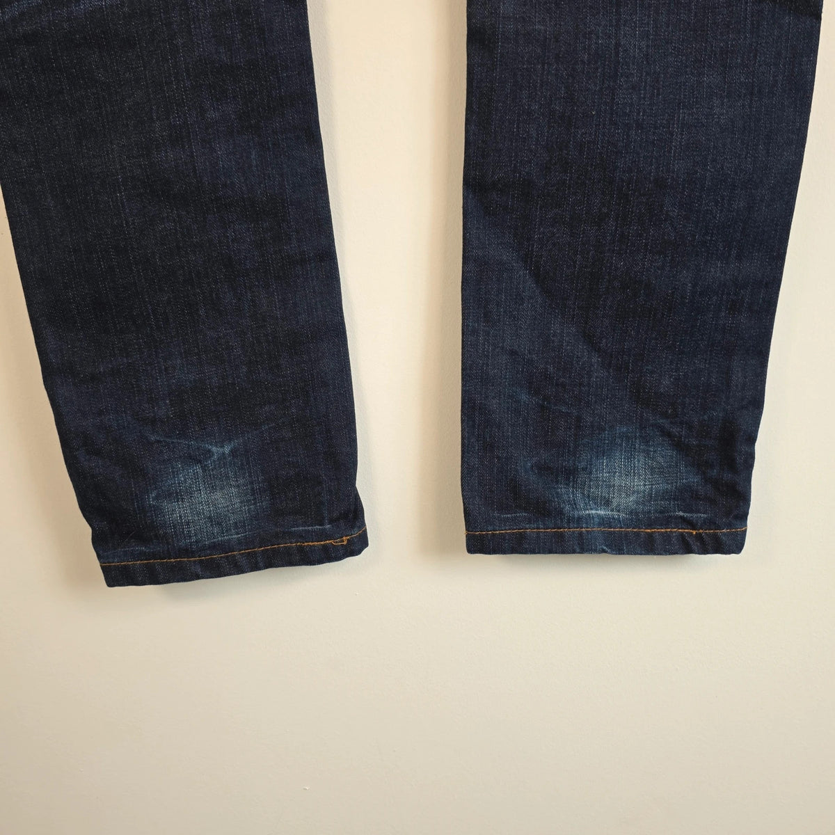 Superdry blue selvedge jeans with contrast stitching and lightly distressed details.