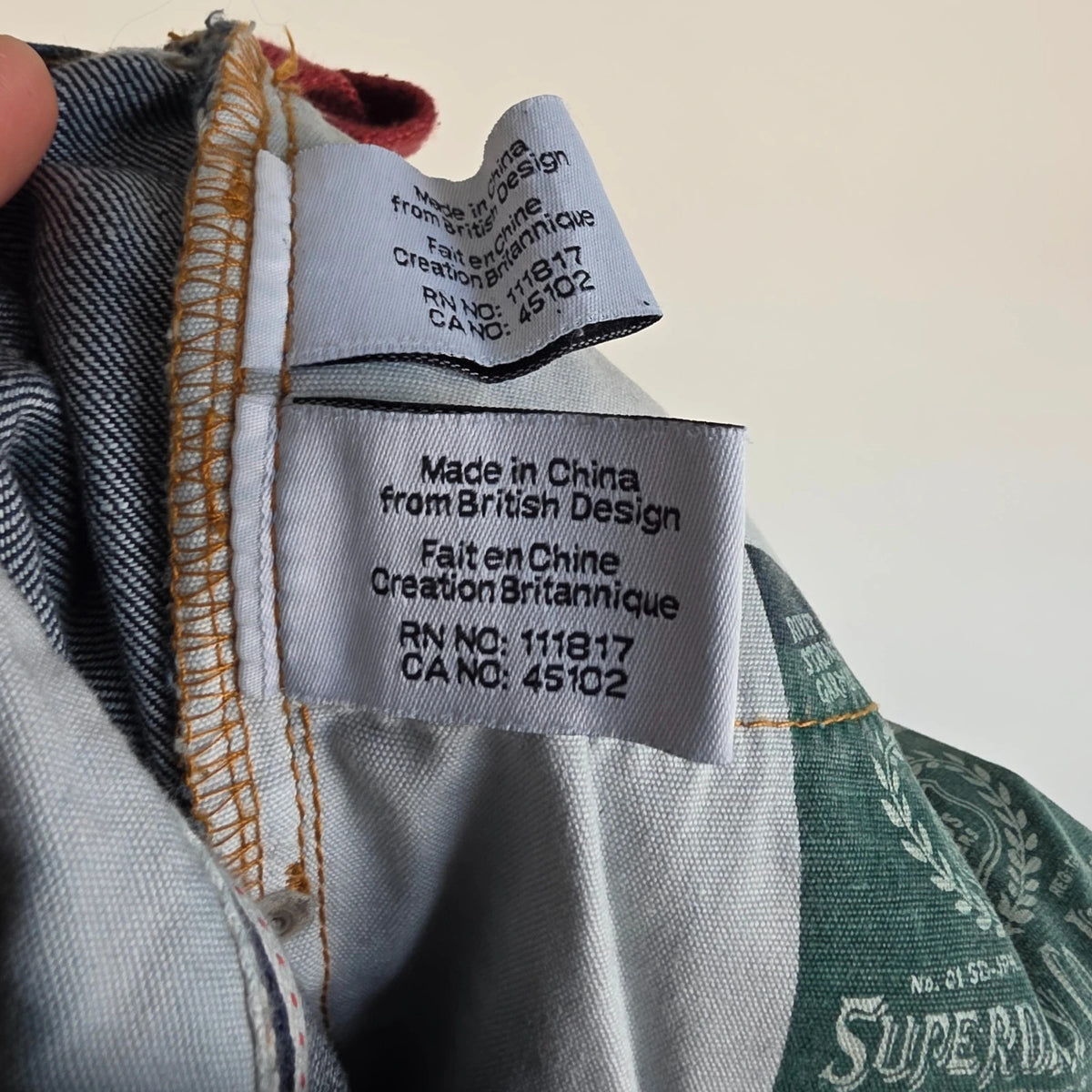 Superdry blue selvedge jeans with contrast stitching and lightly distressed details.