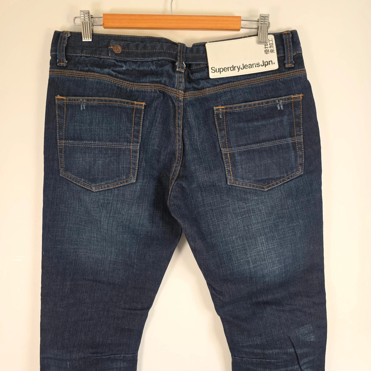 Superdry blue selvedge jeans with contrast stitching and lightly distressed details.