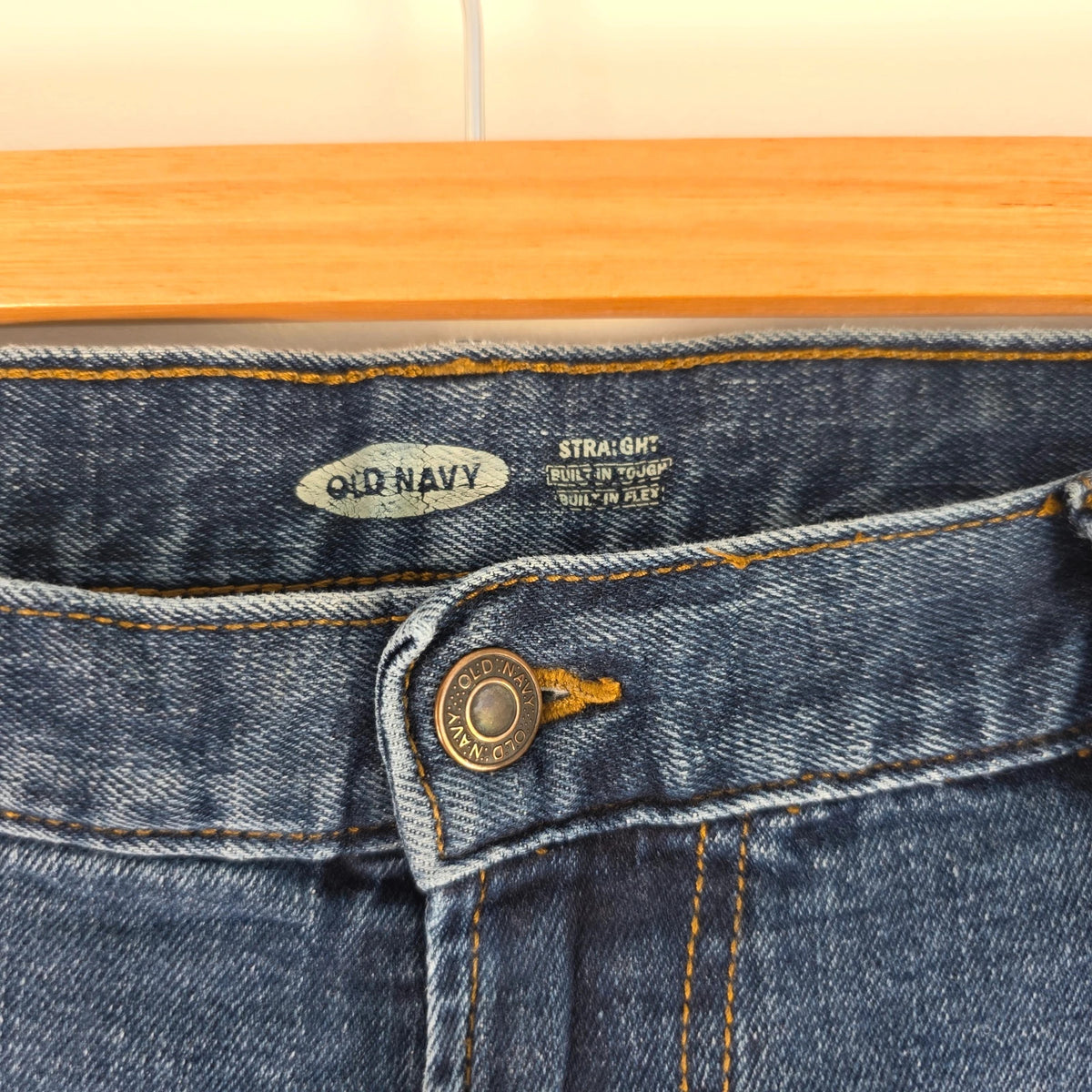 Old Navy blue straight jeans with utility pockets and hammer loop detailing.