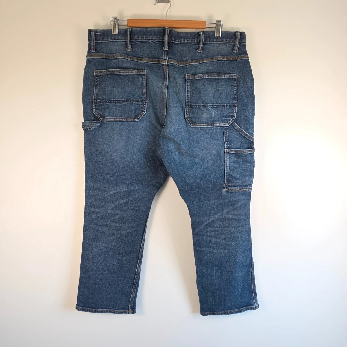 Old Navy blue straight jeans with utility pockets and hammer loop detailing.