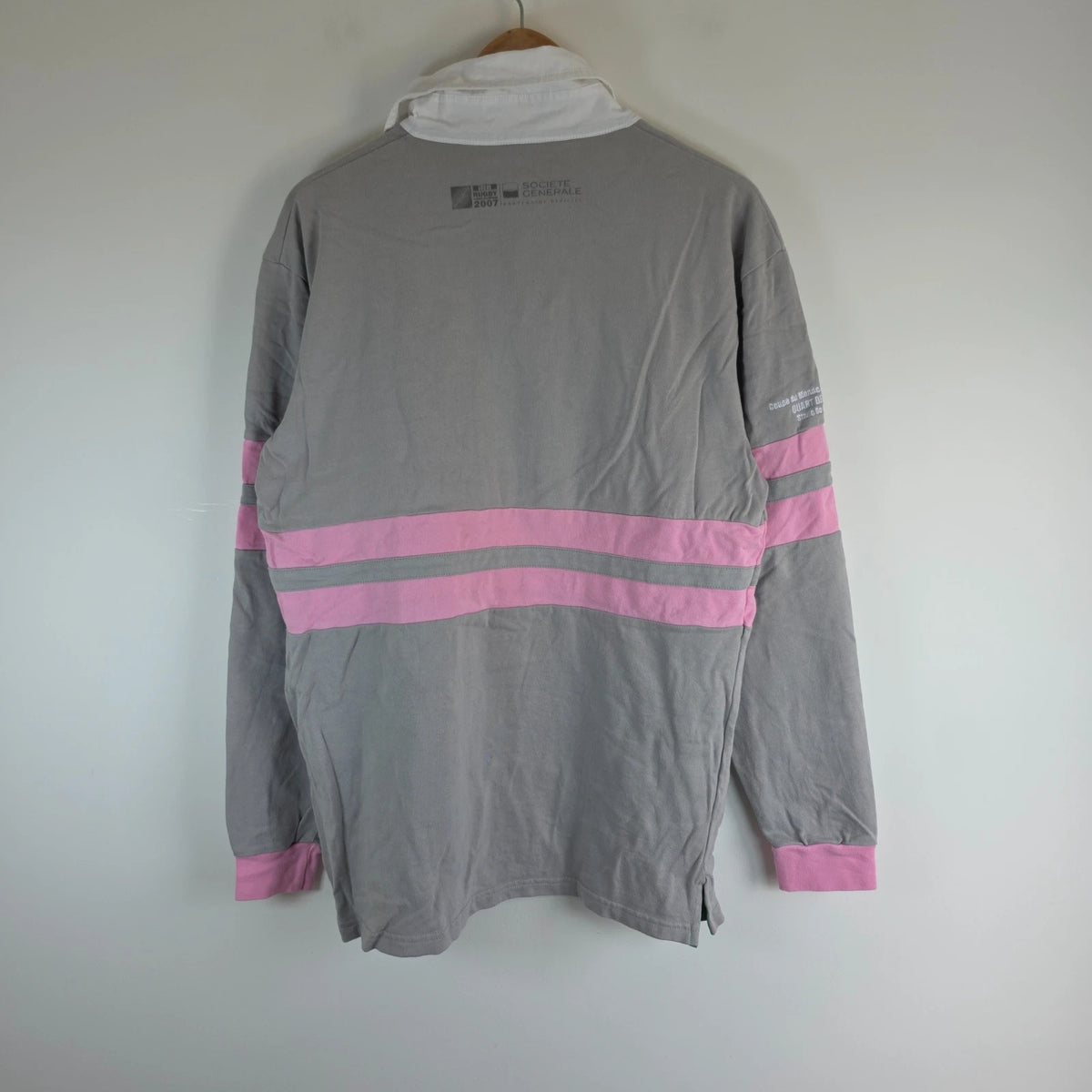 Rugby World Cup grey pink long sleeve polo shirt with IRB logo and Stade de France detail.