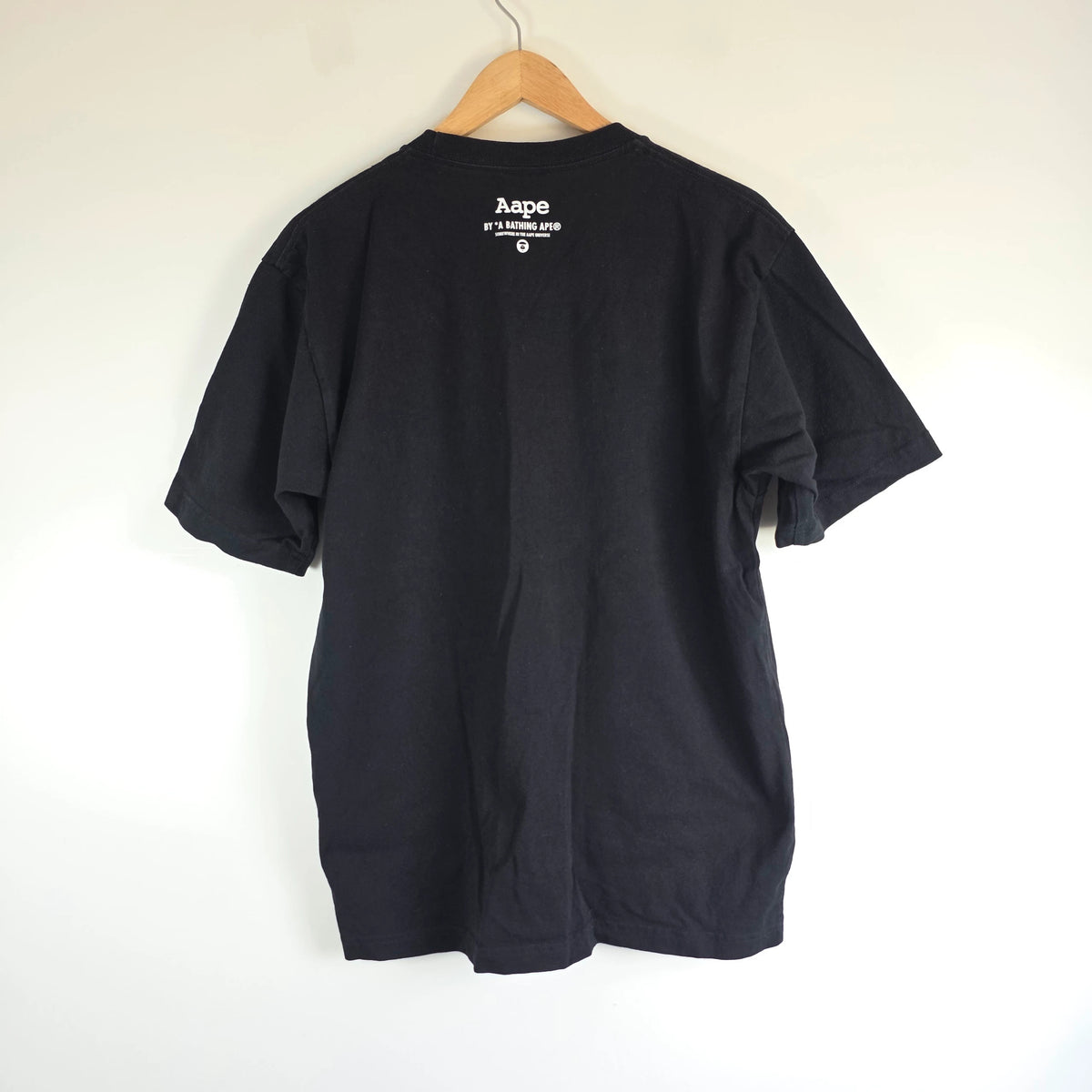 AAPE by A Bathing Ape black T-shirt with large camo ape head graphic and branded sleeve.