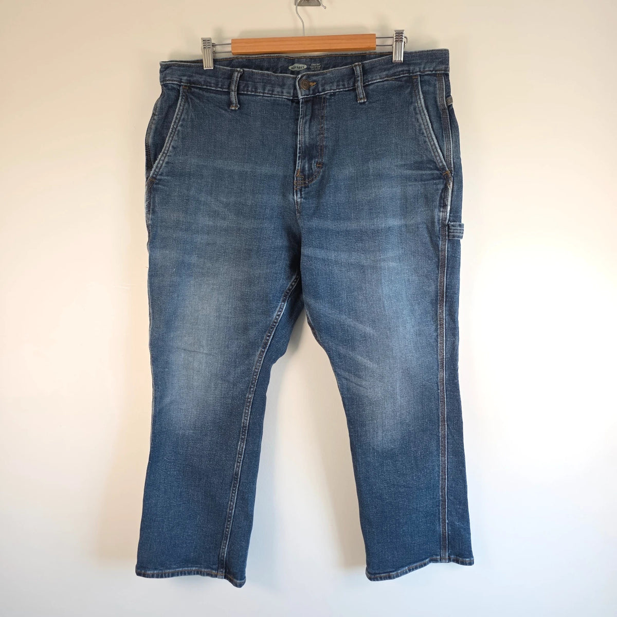 Old Navy blue straight jeans with utility pockets and hammer loop detailing.