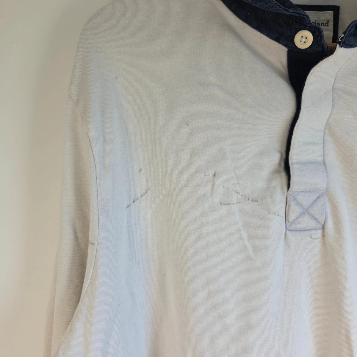 England Rugby white long sleeve polo shirt with rose logo and rugby jersey style.