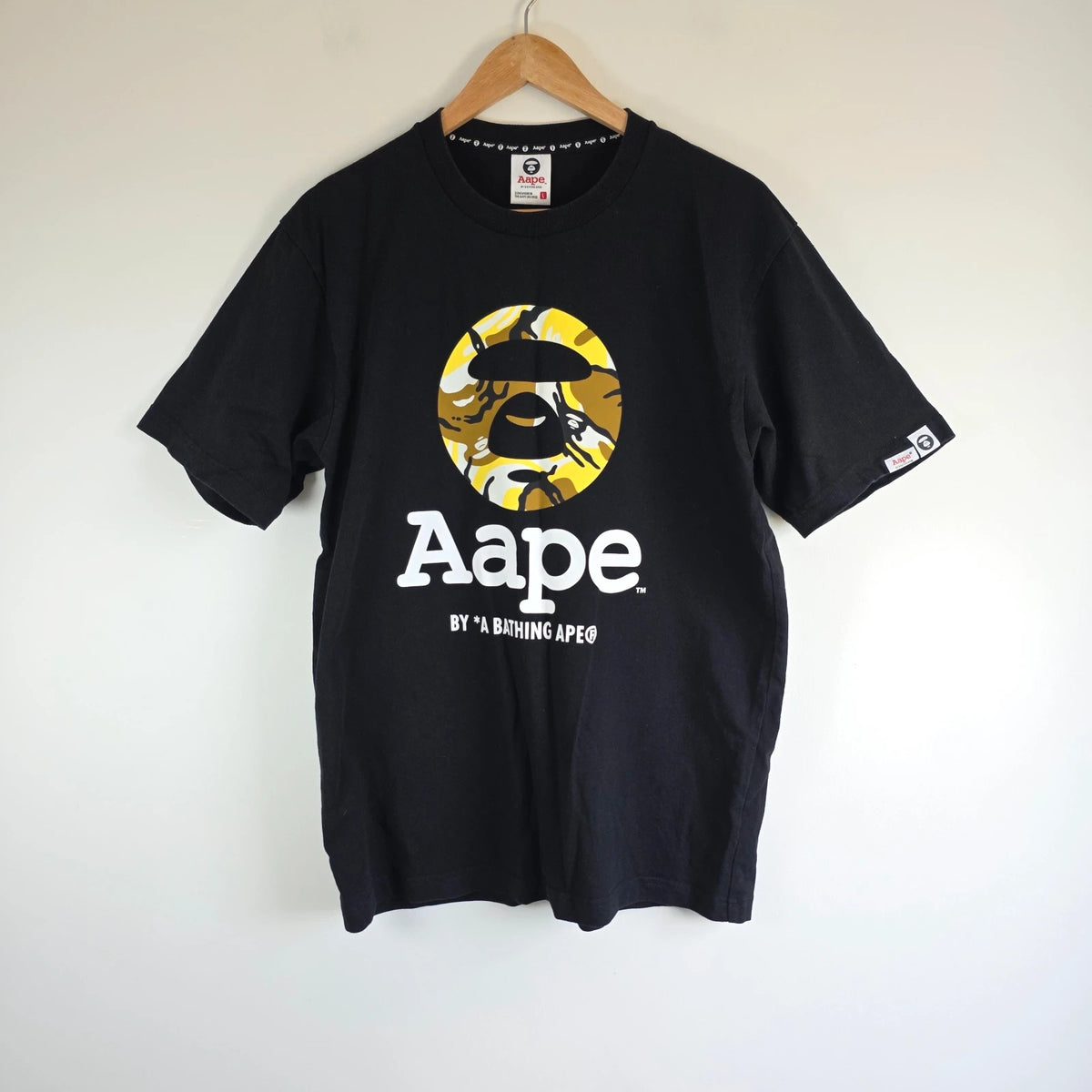 AAPE by A Bathing Ape black T-shirt with large camo ape head graphic and branded sleeve.