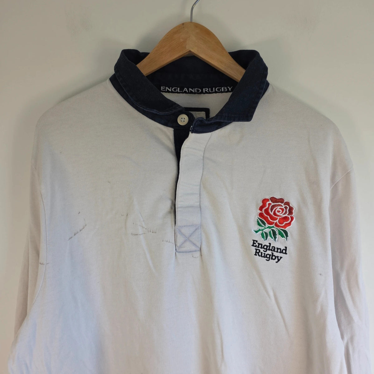 England Rugby white long sleeve polo shirt with rose logo and rugby jersey style.