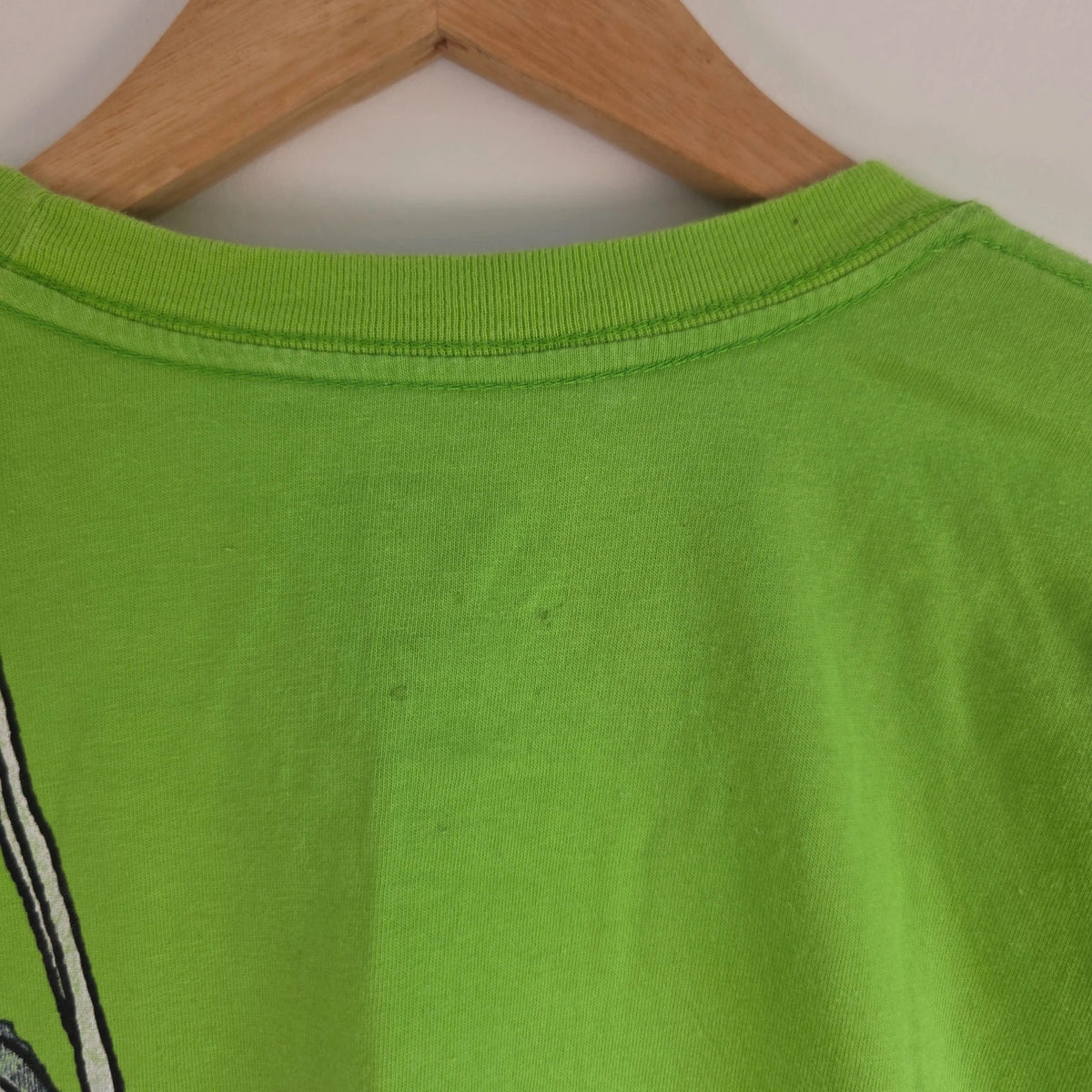 Nike graphic T-shirt bright green sneaker print Y2K streetwear style.