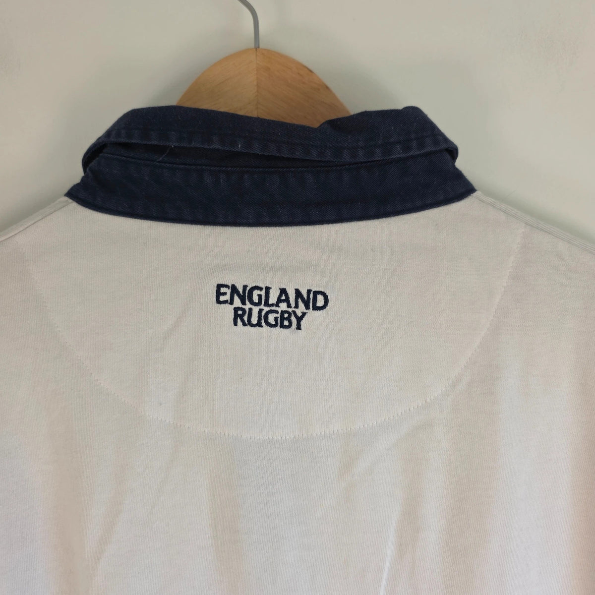 England Rugby white long sleeve polo shirt with rose logo and rugby jersey style.