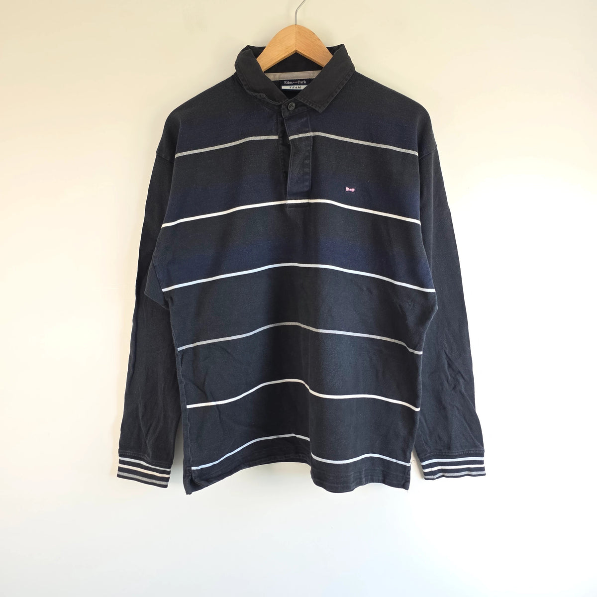 Eden Park navy striped rugby shirt with pink bow tie appliqué and long sleeves.