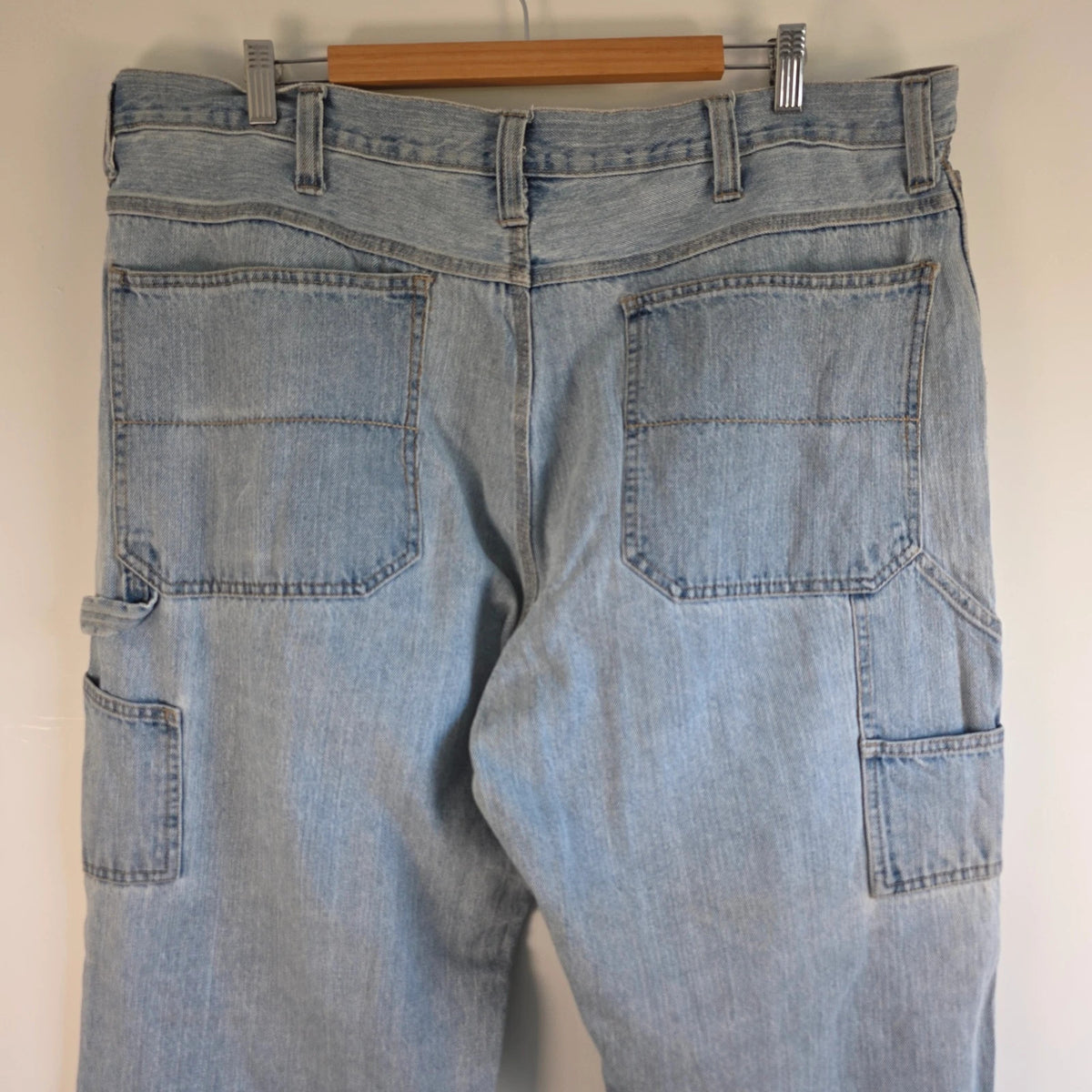 Faded Glory blue straight jeans with utility pockets and hammer loop in light washed denim.