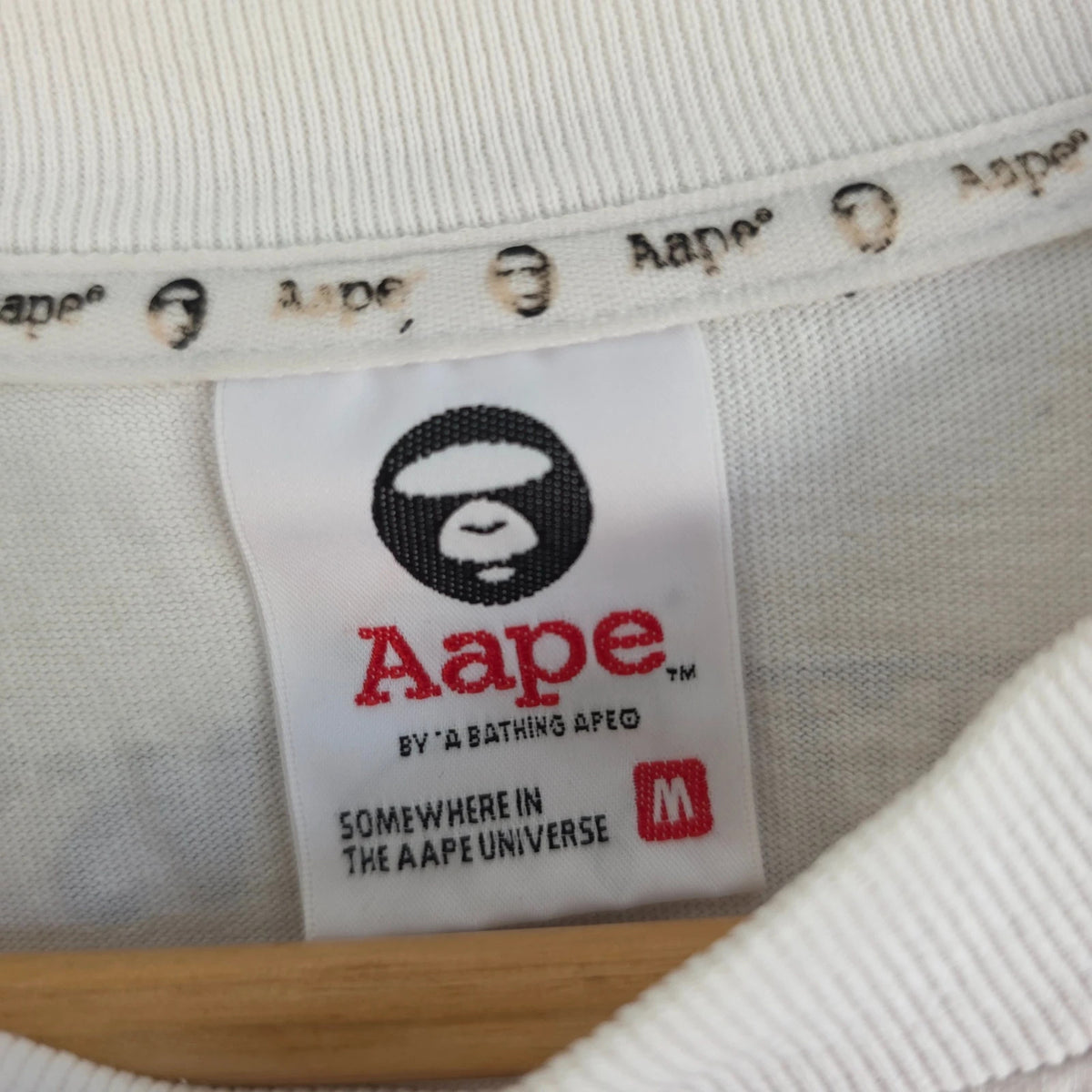 AAPE by A Bathing Ape white graphic T-shirt featuring Ape Universe skull print.