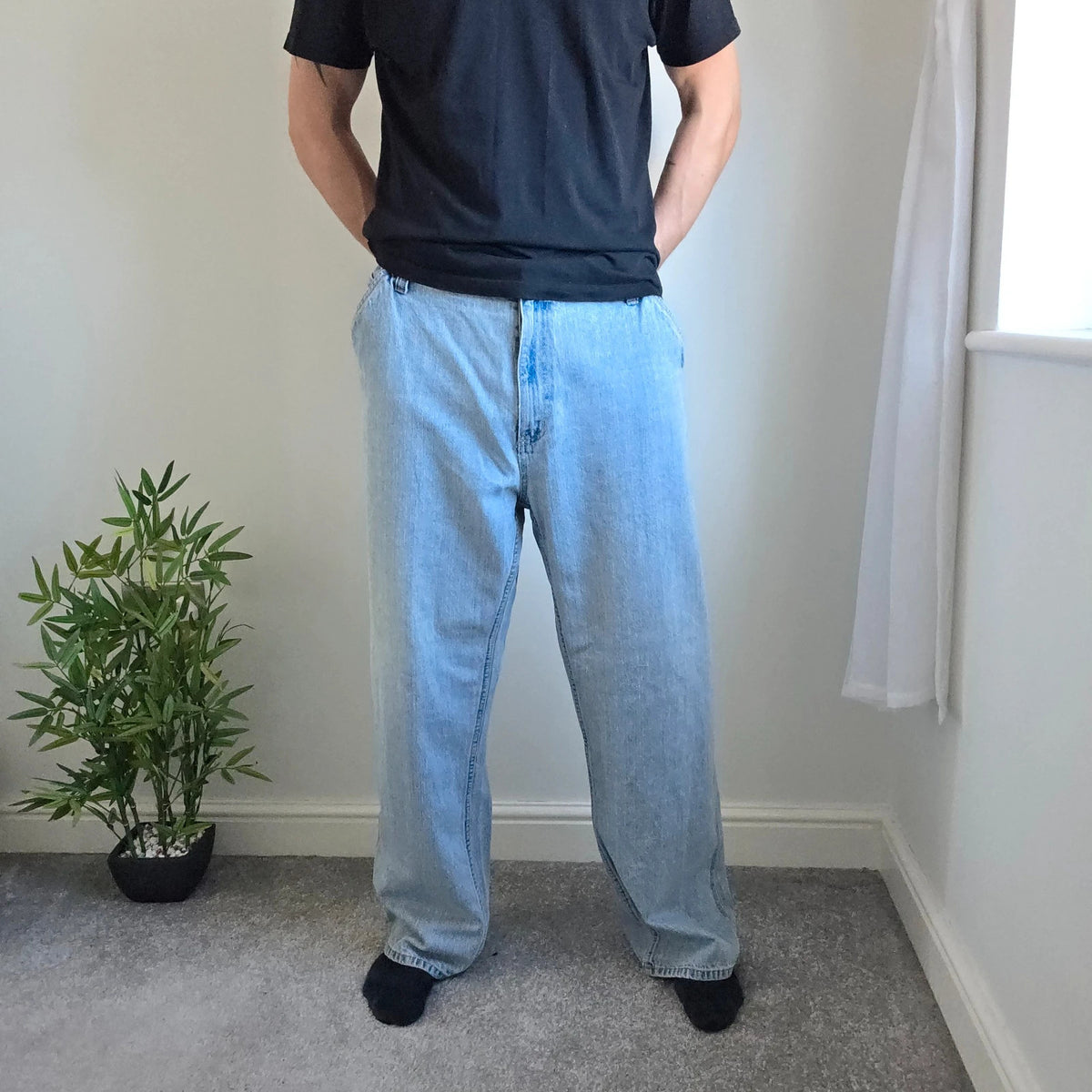 Faded Glory blue straight jeans with utility pockets and hammer loop in light washed denim.