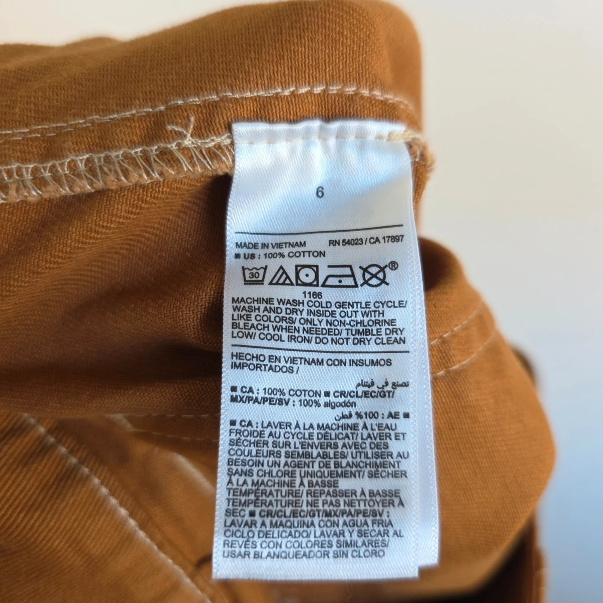 Old Navy brown straight jeans with utility details, contrast stitching, and hammer loop.