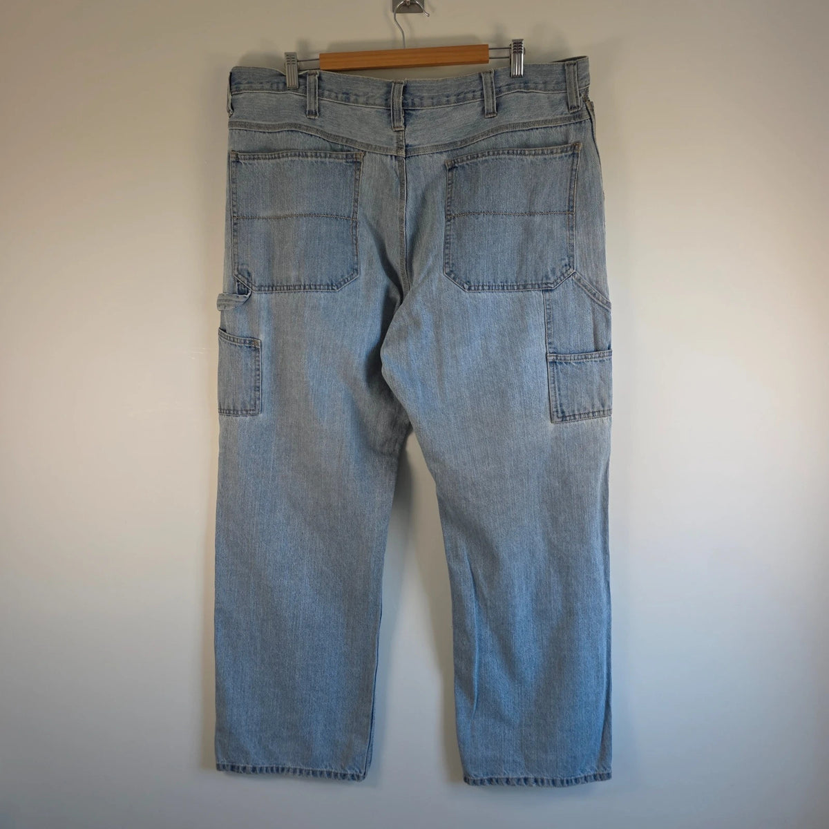 Faded Glory blue straight jeans with utility pockets and hammer loop in light washed denim.