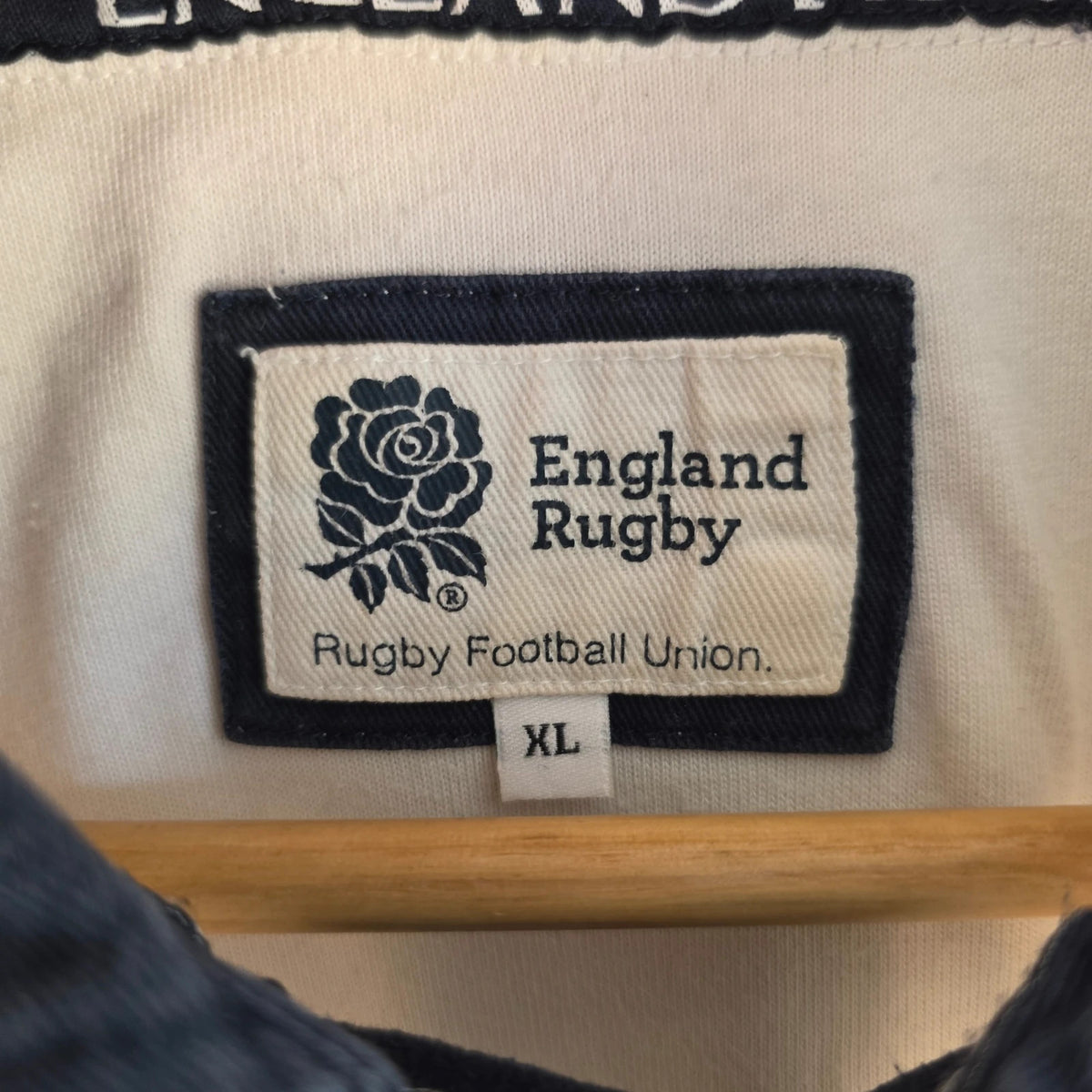 England Rugby white long sleeve polo shirt with rose logo and rugby jersey style.