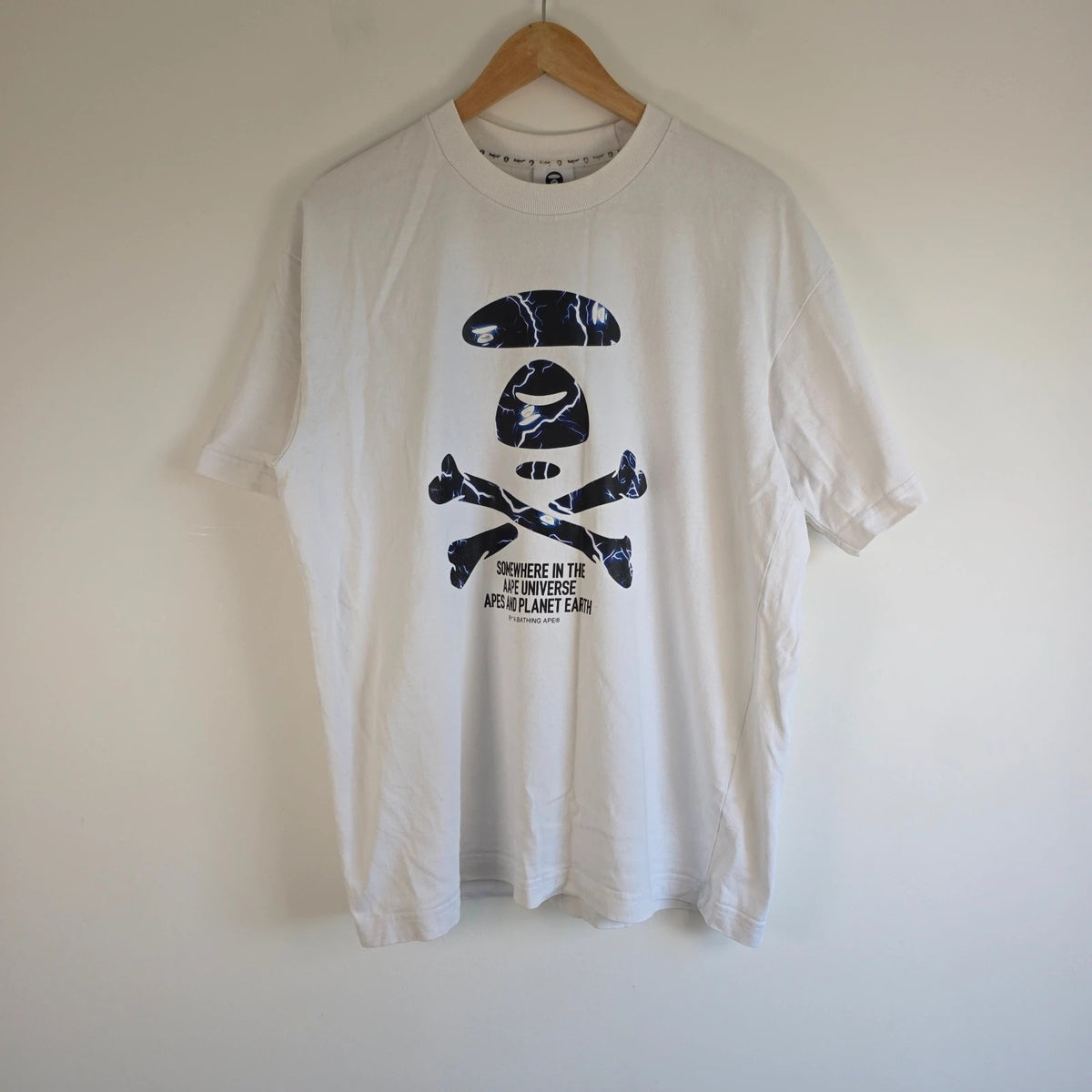 AAPE by A Bathing Ape white graphic T-shirt featuring Ape Universe skull print.