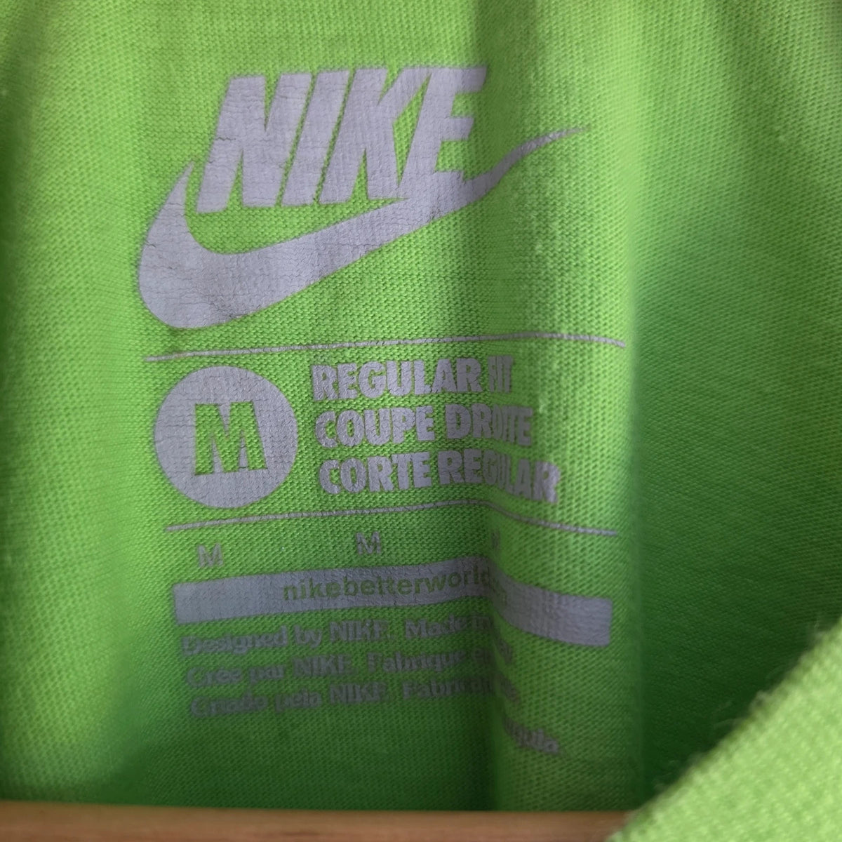 Nike graphic T-shirt bright green sneaker print Y2K streetwear style.