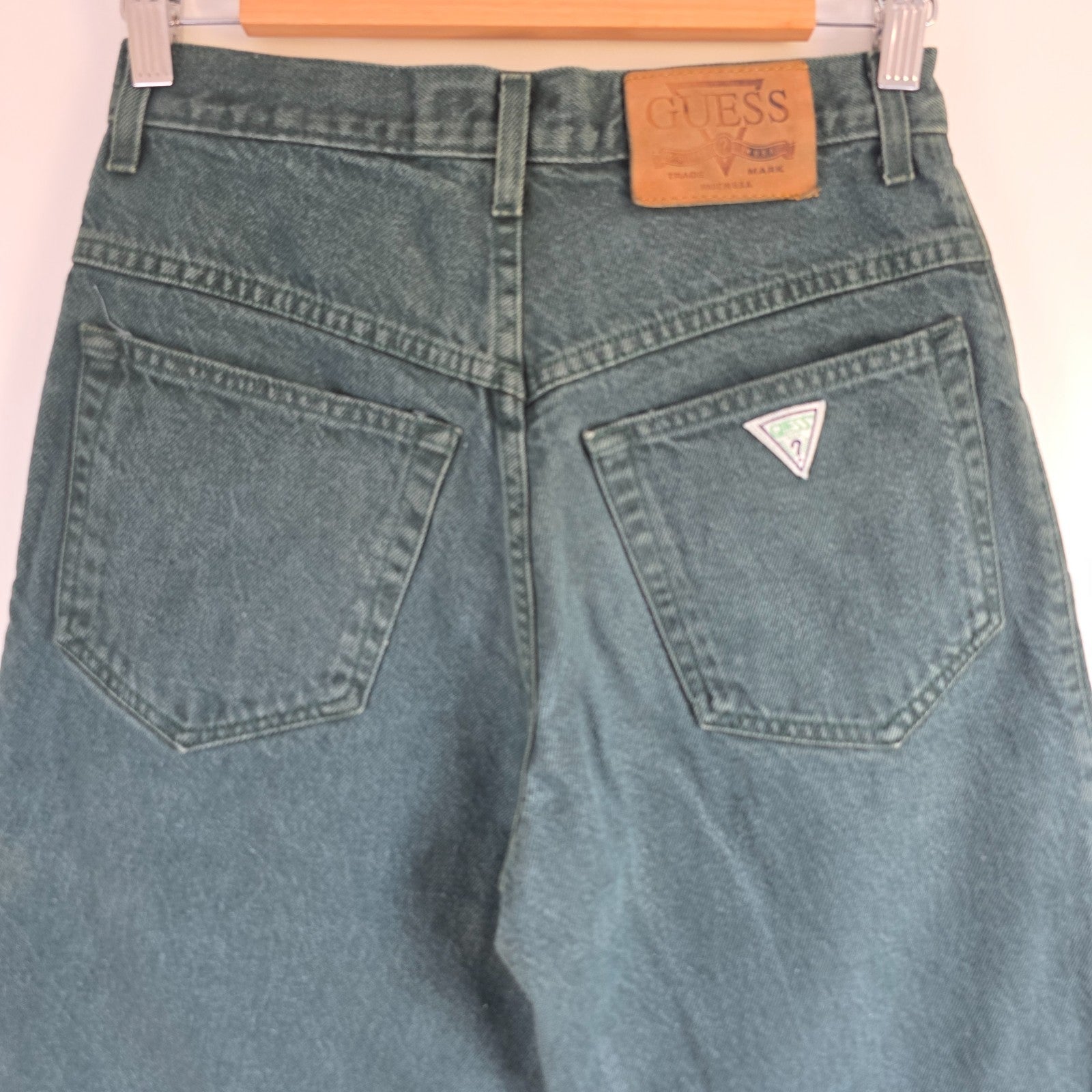 Levi's 501 white jeans distressed with natural wear, made in USA, classic fit.