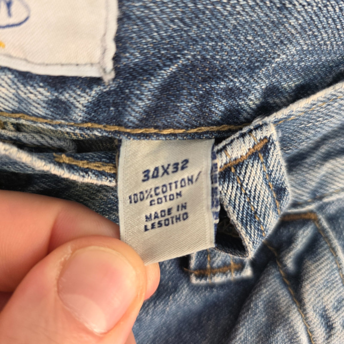 Old Navy blue carpenter jeans with hammer loop and utility pocket detailing.